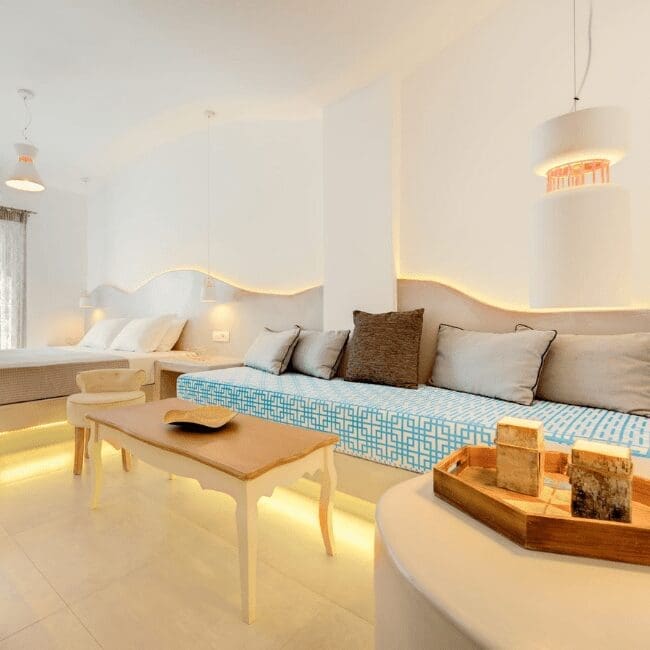 Lounge seating with a blue mosaic sofa base in the Suite with Pool View