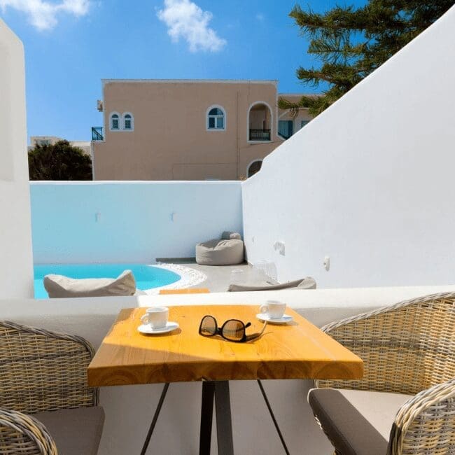 Private balcony table overlooking a plunge pool in the Suite with Pool View
